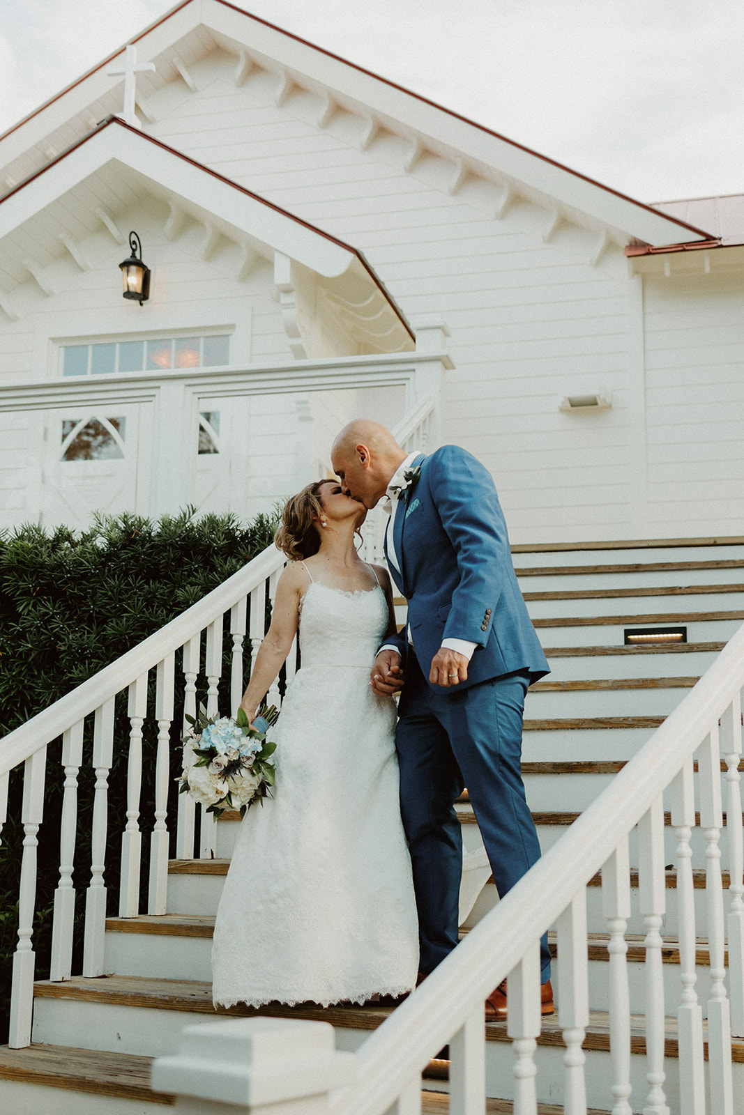 the couple kissing on the chapel stairs during the Savannah Georgia Elopement