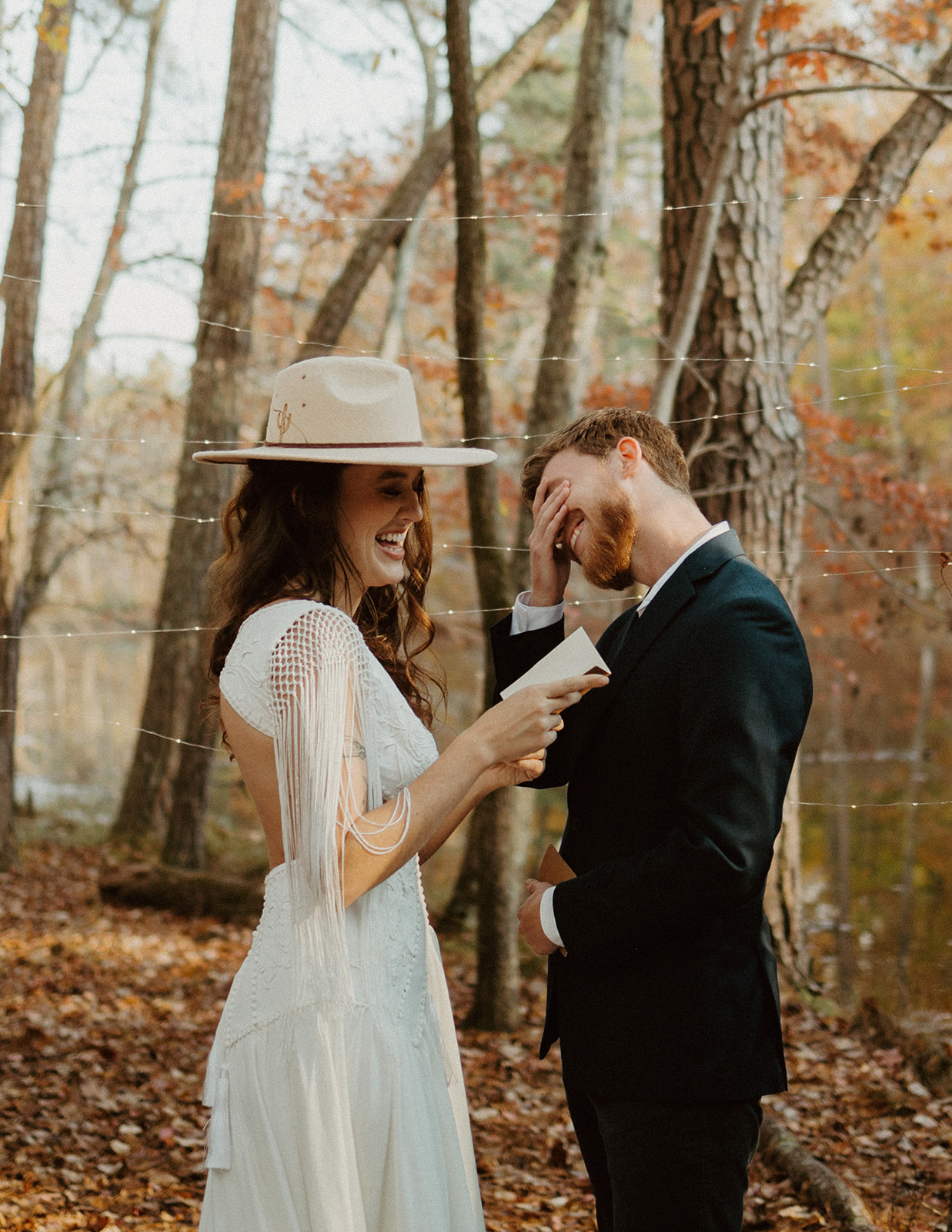 the couple laughing together during their vows at their elopement in Georgia