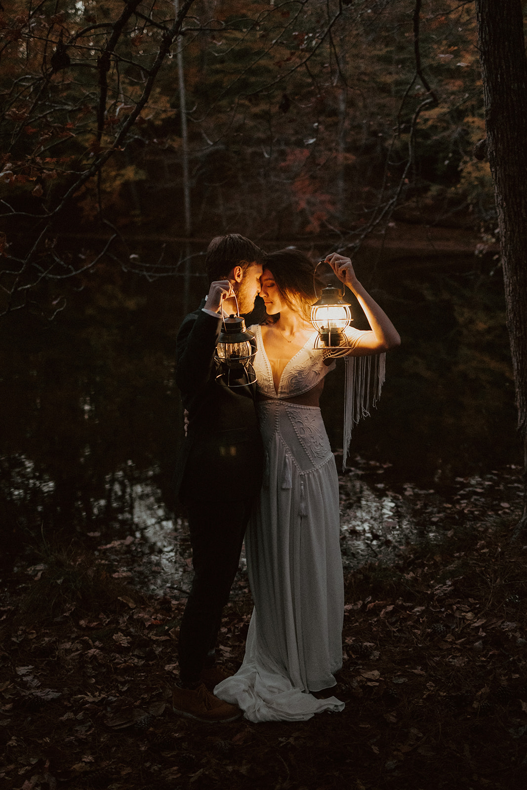 the couple touching their foreheads that evening with their lanterns