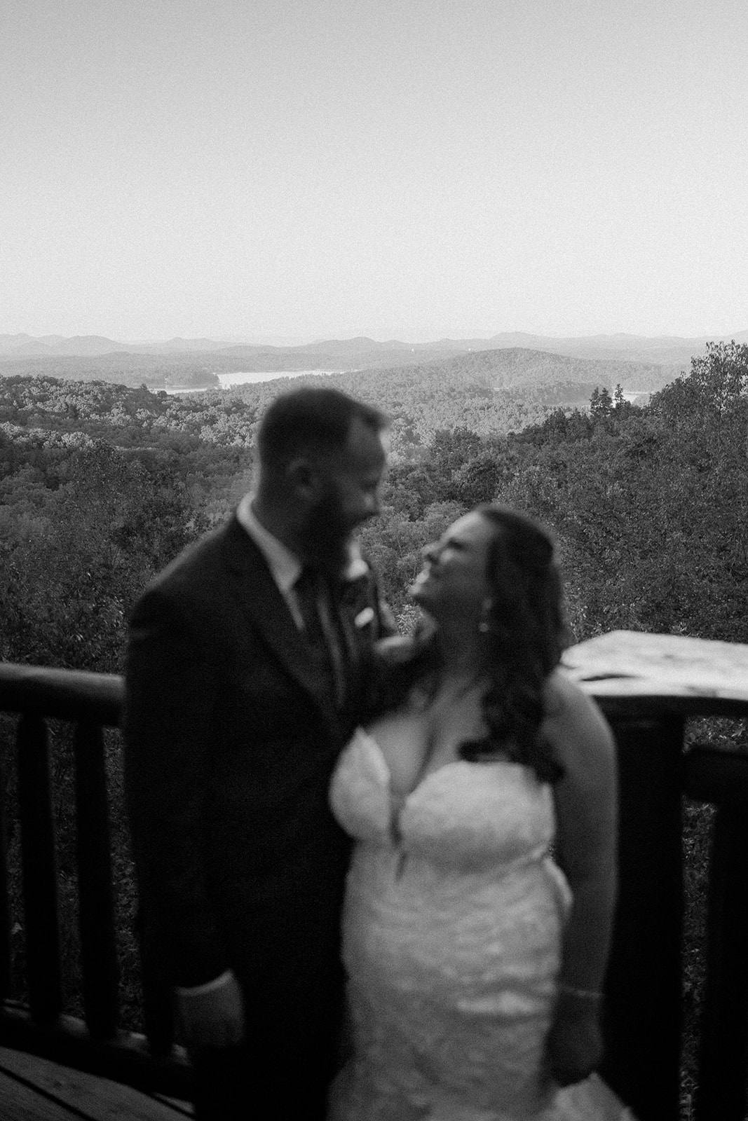 the couple standing together on the balcony of the airbnb wedding venue