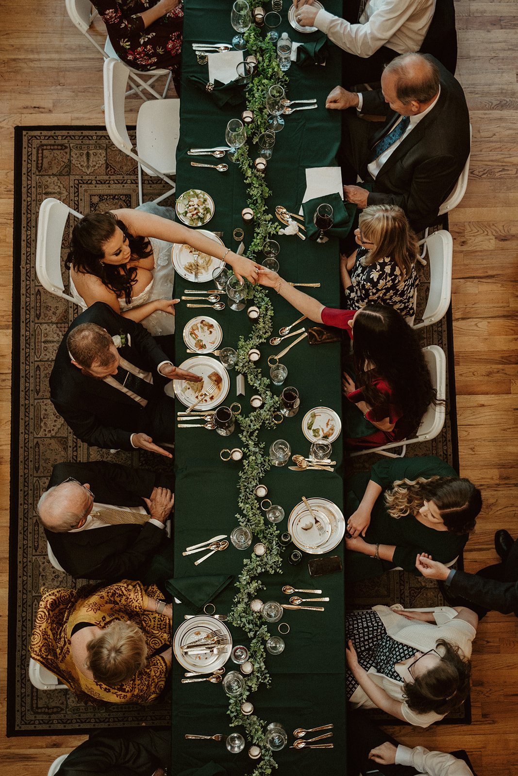 everyone gathered around the table for the reception at the airbnb wedding venue