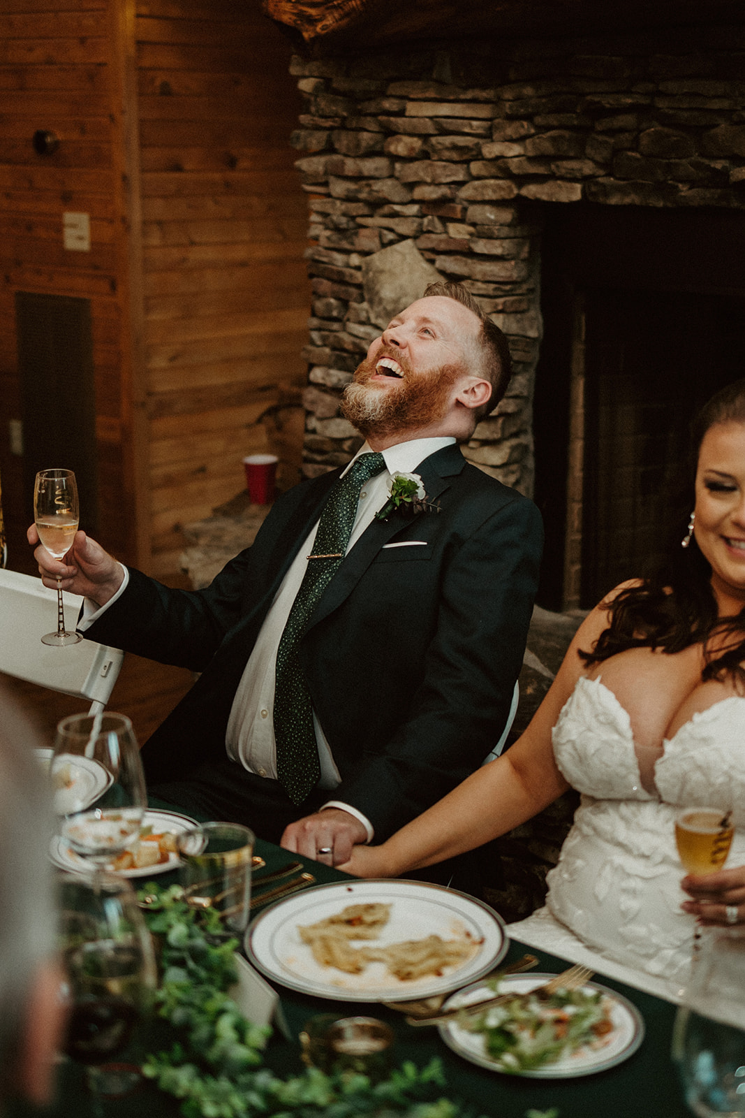 groom laughing at the airbnb wedding venue during the reception