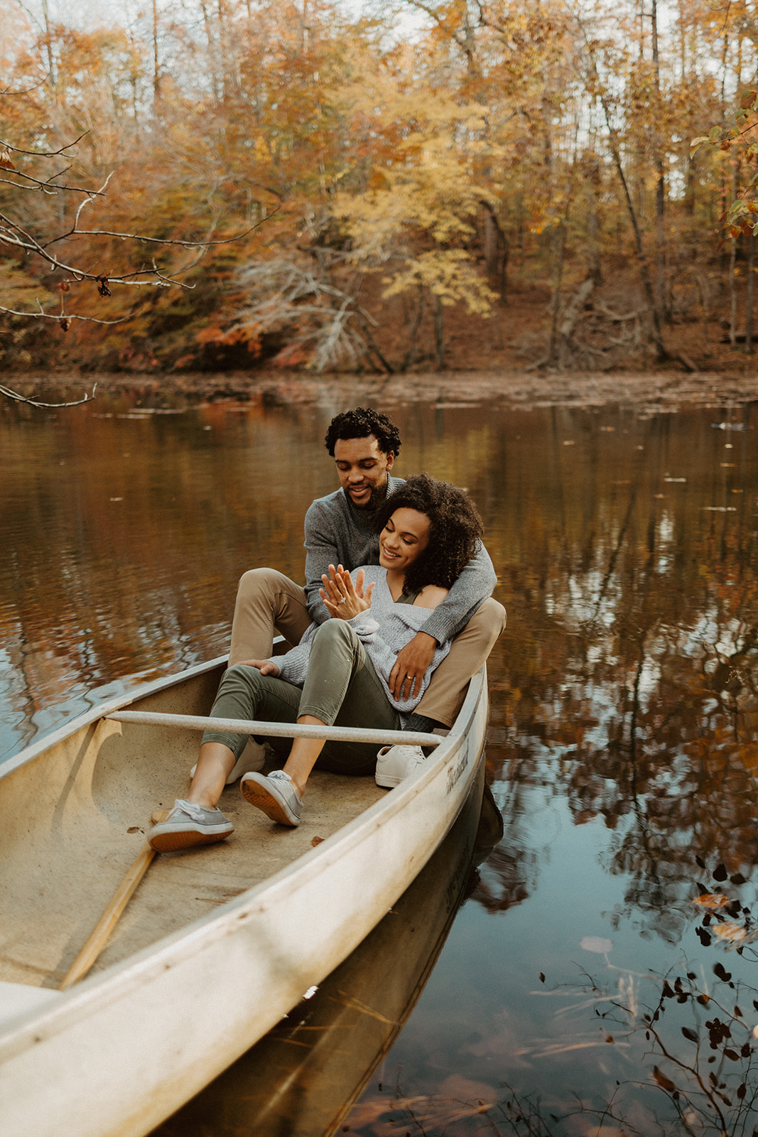 the couple sitting in the canoe together