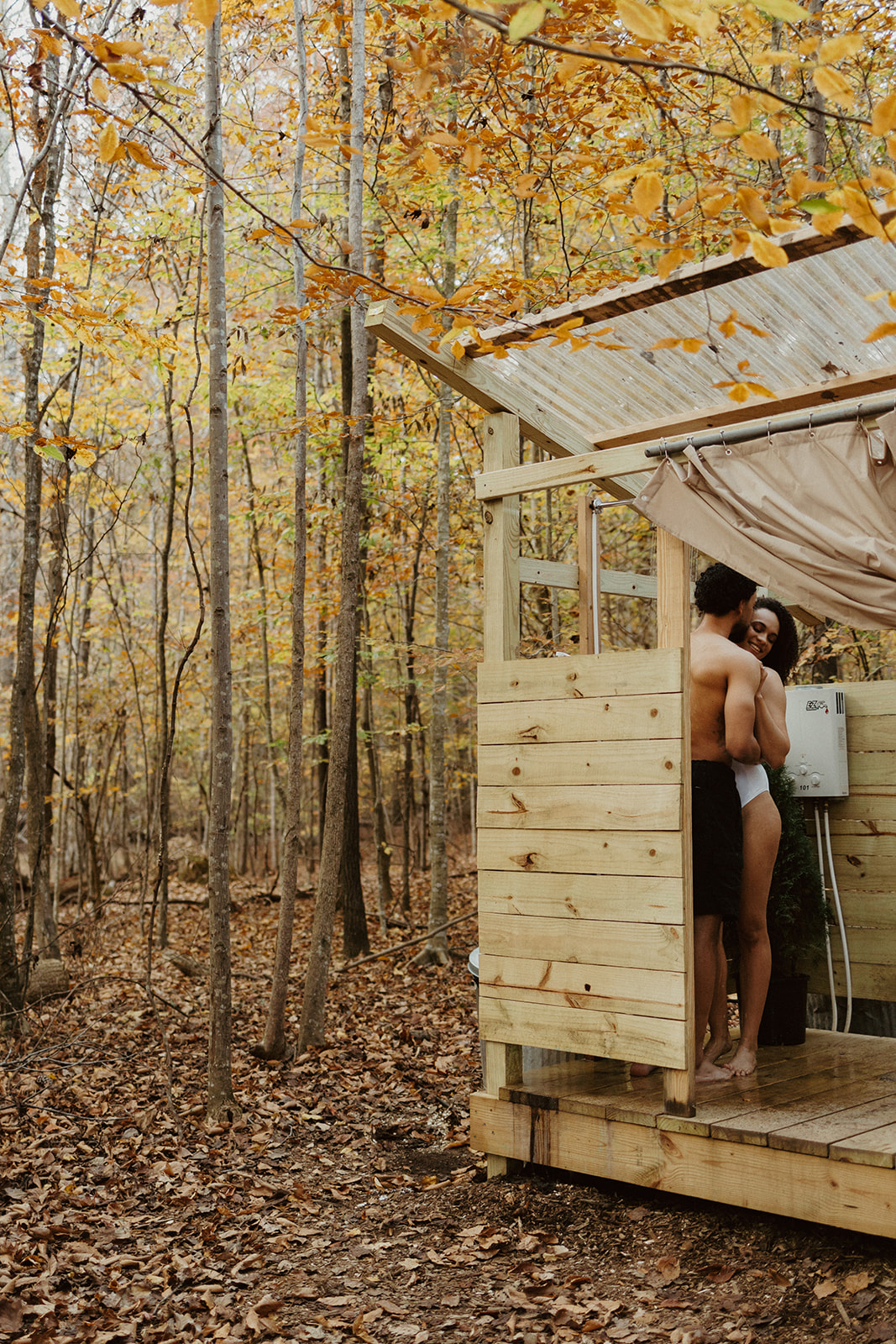 the couple hanging out in the airbnb outdoor shower