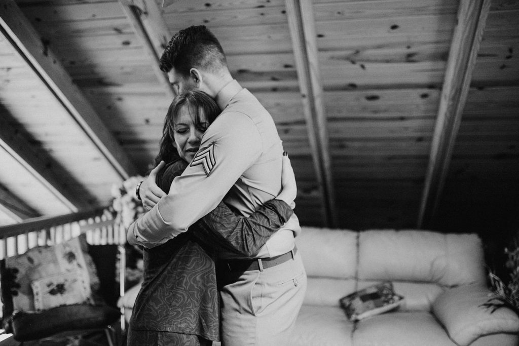 the groom and his mother hugging for getting ready photos